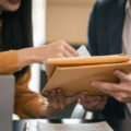 A man and woman reviewing some documents
