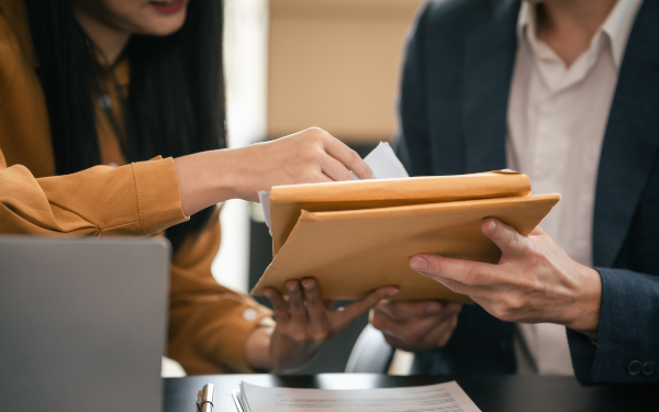 A man and woman reviewing some documents