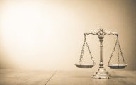 Image of scales of justice (credit: BrAt82 / Adobe Stock)