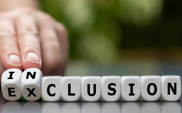 Symbol for a better inclusion. Hand turns dice and changes the word exclusion to inclusion.