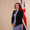 Bridget Phillipson standing in front of a union fla