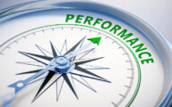 Compass dial pointing to word 'performance'