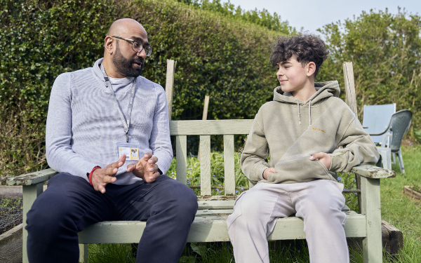 Social worker talking to boy