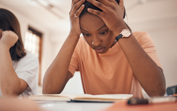 Young girl looking stressed in classroom