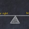 Chalk board sketch of scales. Concept of balance between eye sight and hearing