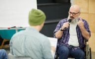 Disabled man giving a talk