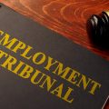 Book with title employment tribunal on a table.