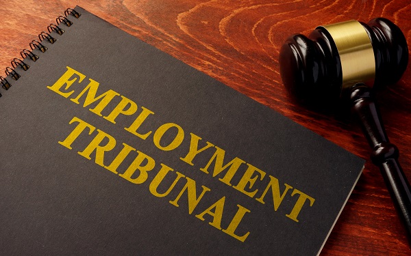 Book with title employment tribunal on a table.