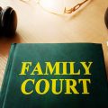 Image of book marked 'family court' and judge's gavel (credit: Vitalii Vodolazskyi / Adobe Stock)