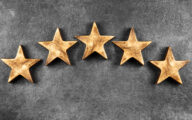 Five stars against dark background