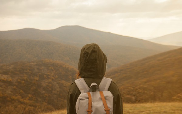 woman looking at view from mountains