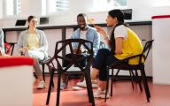 A meeting involving three people