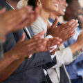 A group of colleagues clapping their hands