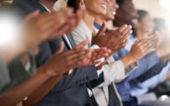 A group of colleagues clapping their hands