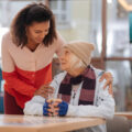 Homeless older woman and social worker