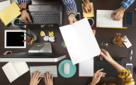 Group of Business People Working on an Office Desk