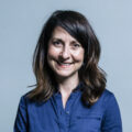 Liz Kendall, smiling, wearing a blue shirt