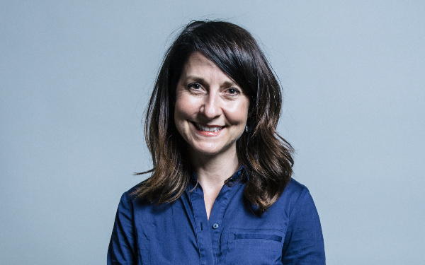 Liz Kendall, smiling, wearing a blue shirt