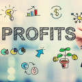 Screen with the word 'profits' written on it along with various related symbols