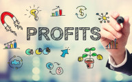 Screen with the word 'profits' written on it along with various related symbols