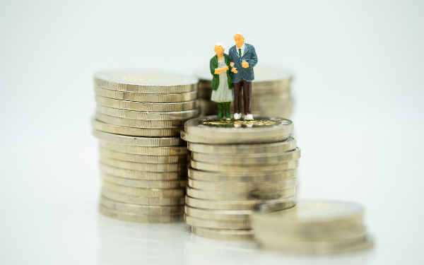 Miniature people: Happy old people standing on coins stack, Retirement planning, Emergency plan, Life insurance and Financial Concept.