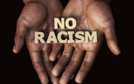 No Racism sign being held