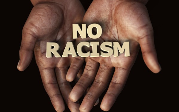 No Racism sign being held