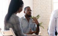 Man speaking at peer support session