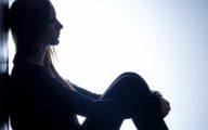 woman looking downcast
