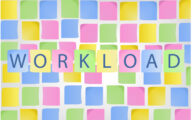 Post-it notes on a wall with the word 'workload' in the foreground