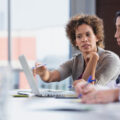 Three social workers discussing a case in their office