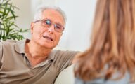 Senior man with social worker