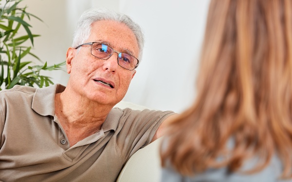 Senior man with social worker