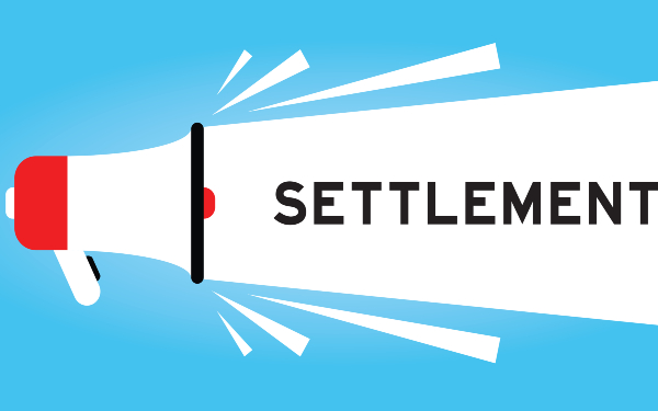 A meagaphone bearing the word 'settlement'