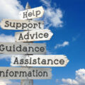 Help, support, advice, guidance, assistance, information - wooden signpost with six arrows