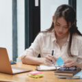 Social work student or young social worker doing some work at home on a laptop