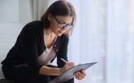 Social worker making notes