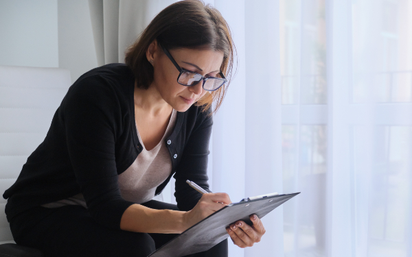 Social worker making notes