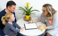 Social worker with dad and child
