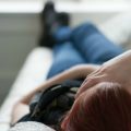 teenager lying with hand on forehead 600