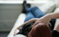 teenager lying with hand on forehead 600