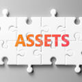 The word 'assets' spelt out in a jigsaw