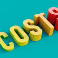 The word 'costs' spelt out in 3-D letters of increasing height against a turquoise background