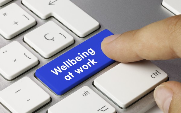 'Wellbeing at work' key being pressed on keyboard