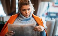 Woman reading a newspaper