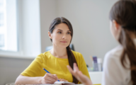 A social worker talking to a young person