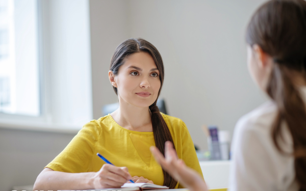 A social worker talking to a young person
