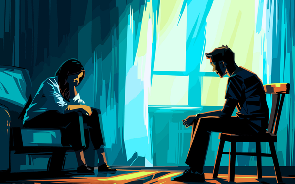 A social worker sits on a couch across a teenage boy, both looking downcast.